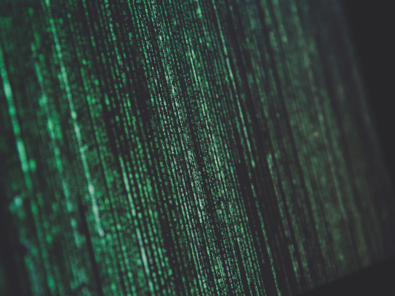 Streams of green characters on a dark screen
