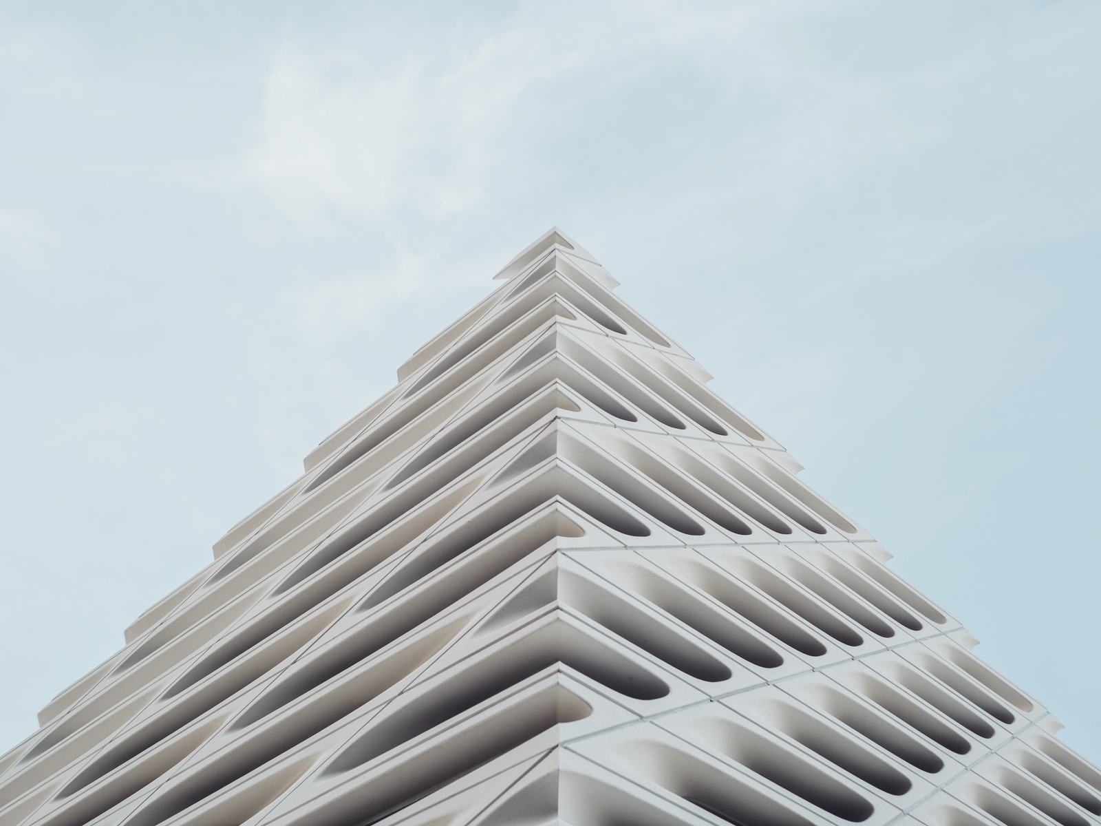 A white stepped building against the sky