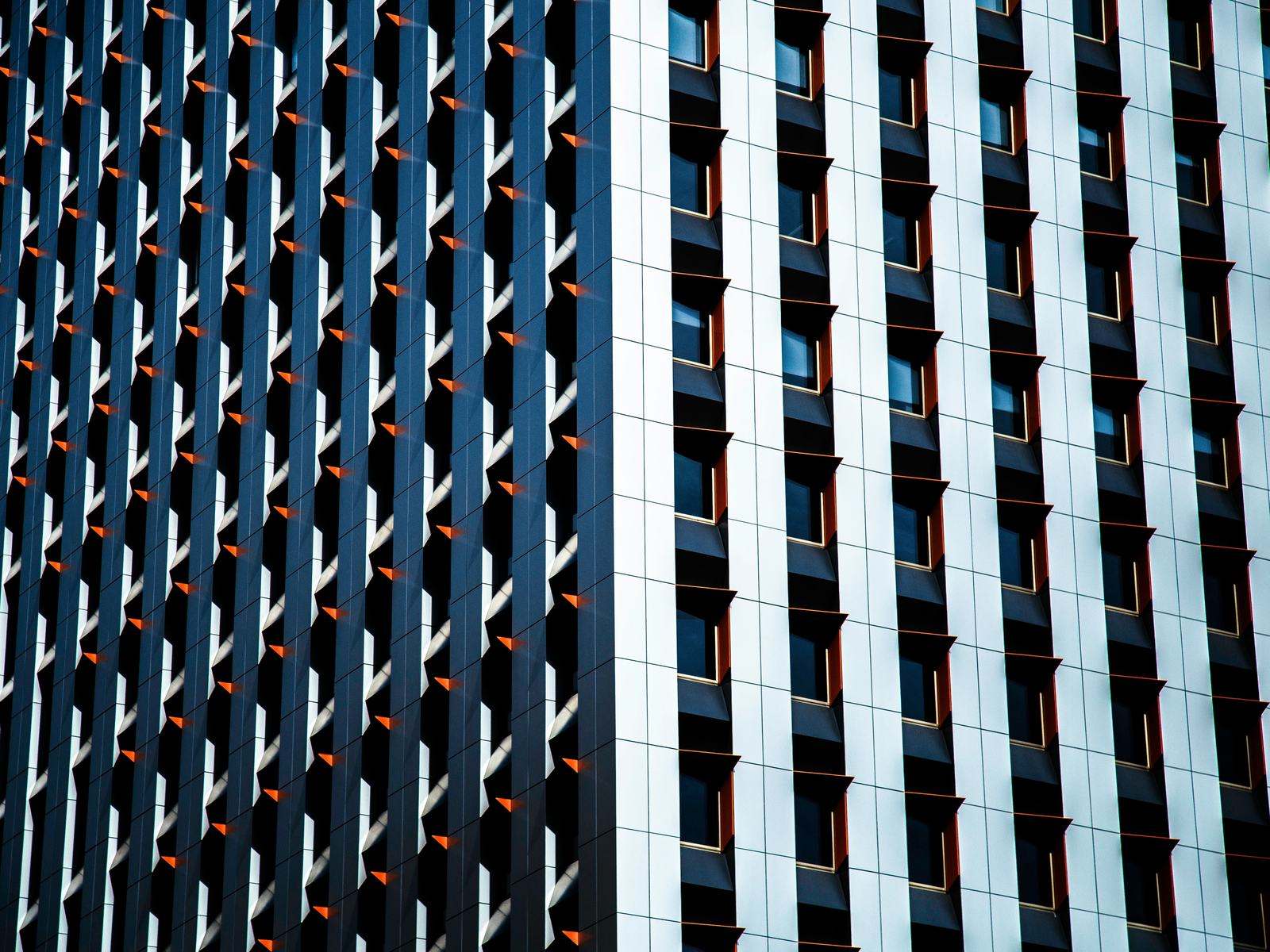Repeating glass and steel facade of an office building